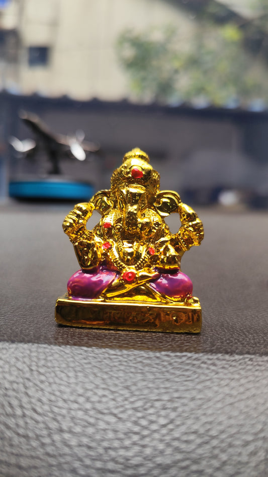 Elegant Golden Lord Ganesha Idol with Pink Dhoti